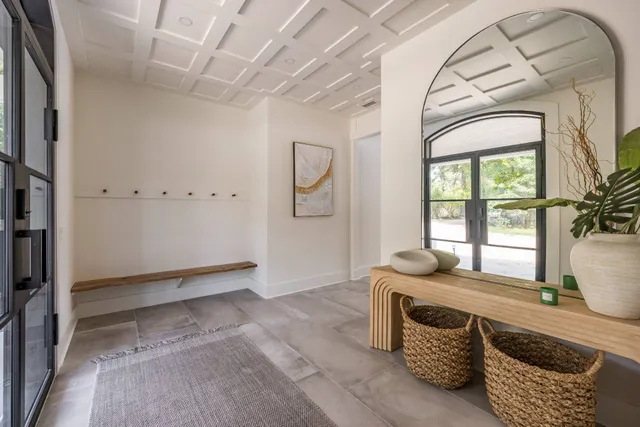 a view of an entryway with wooden floor