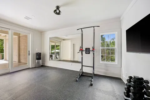 a view of a livingroom with furniture and a flat screen tv
