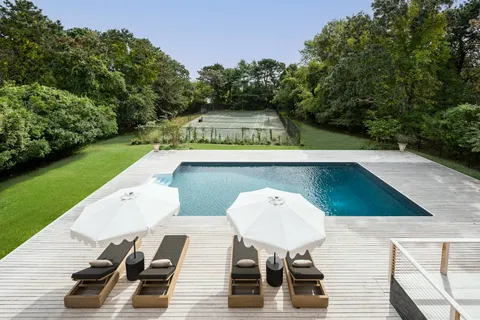 a view of a chairs and table on the deck