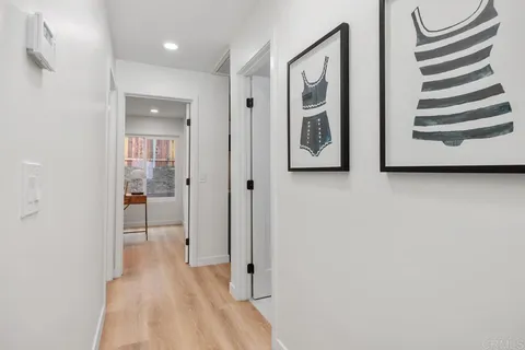 a view of a hallway with front door