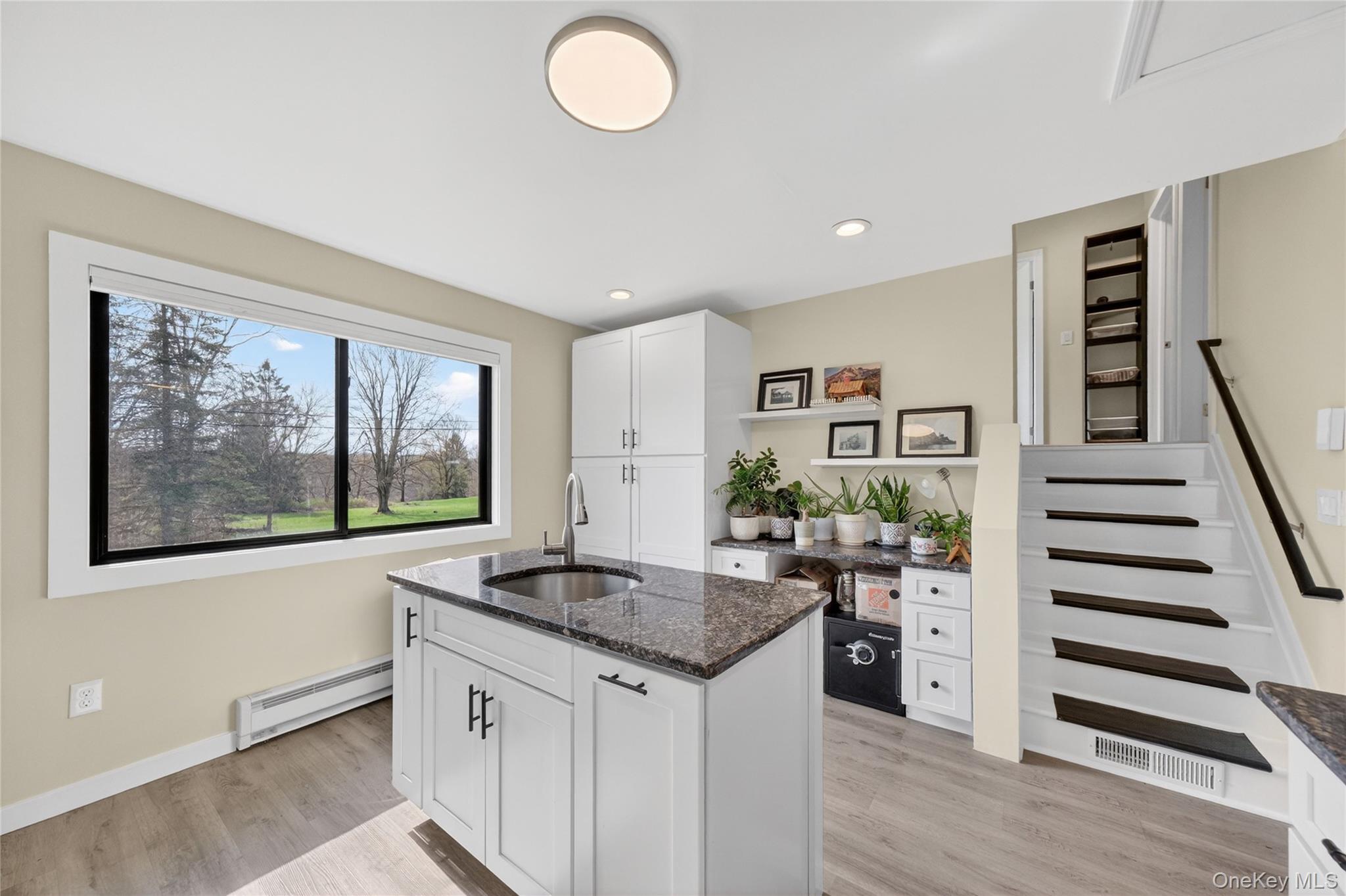 457 Forest Road Wallkill, NY 12589 - Photo 12 of 44 a kitchen with stainless steel appliances granite countertop a stove and a sink