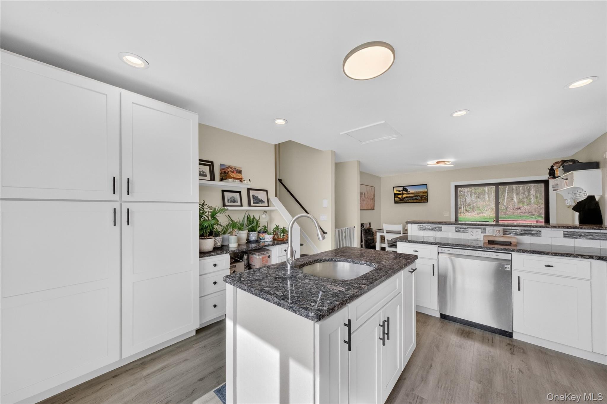 457 Forest Road Wallkill, NY 12589 - Photo 13 of 44 a kitchen with stainless steel appliances granite countertop a sink stove and refrigerator