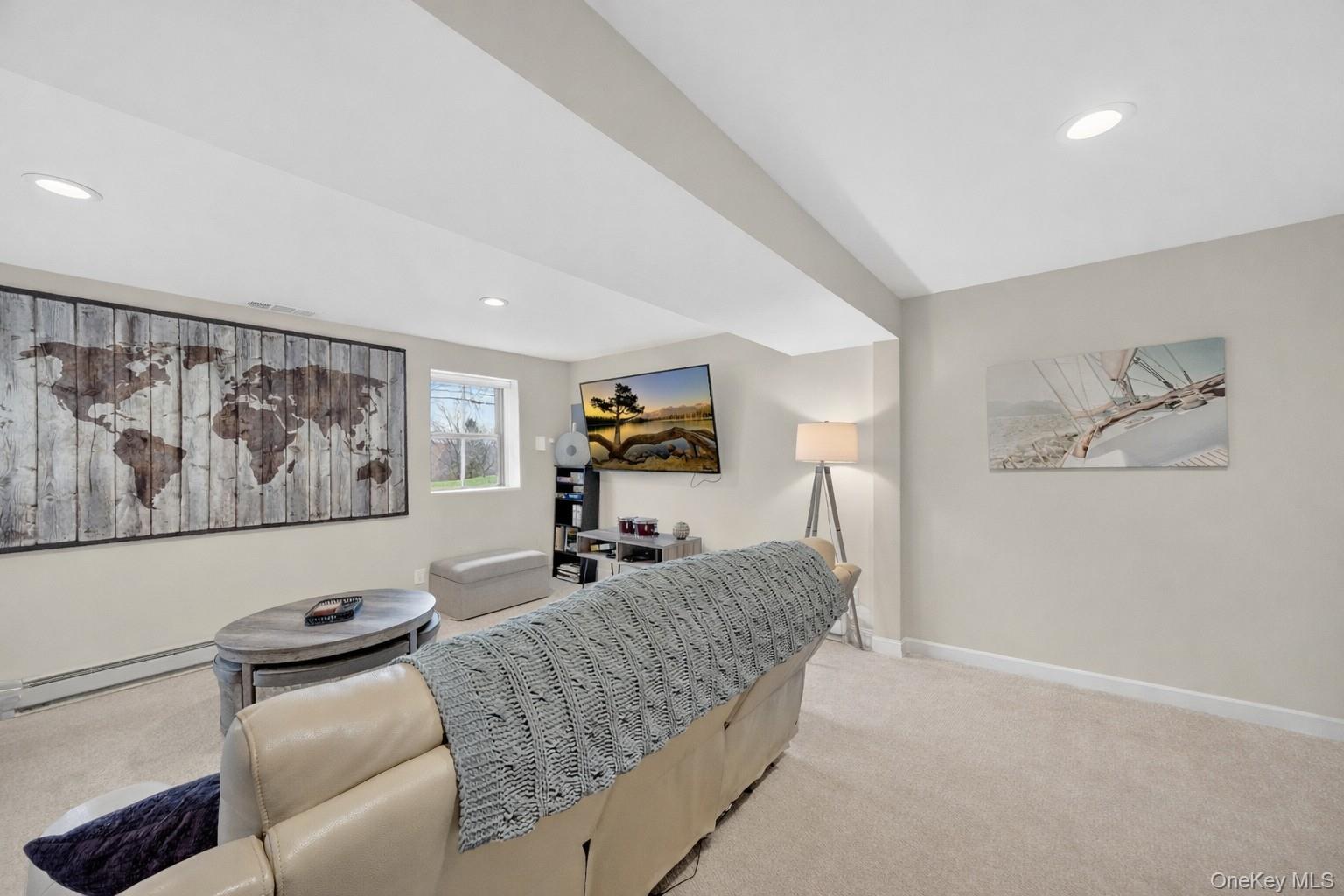 457 Forest Road Wallkill, NY 12589 - Photo 16 of 44 a living room with furniture and wall paintings