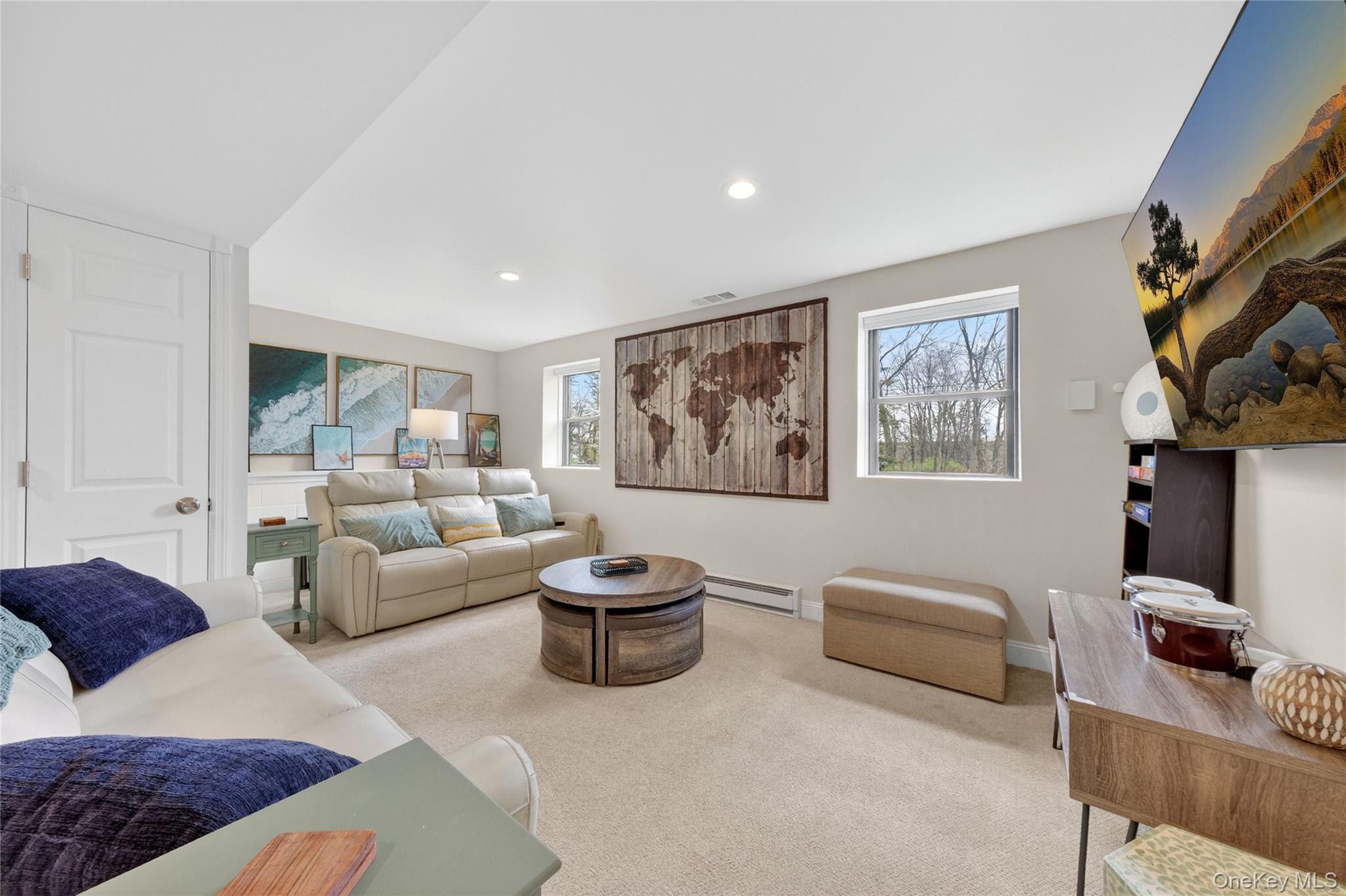 457 Forest Road Wallkill, NY 12589 - Photo 17 of 44 a living room with furniture a rug and a painting on the wall