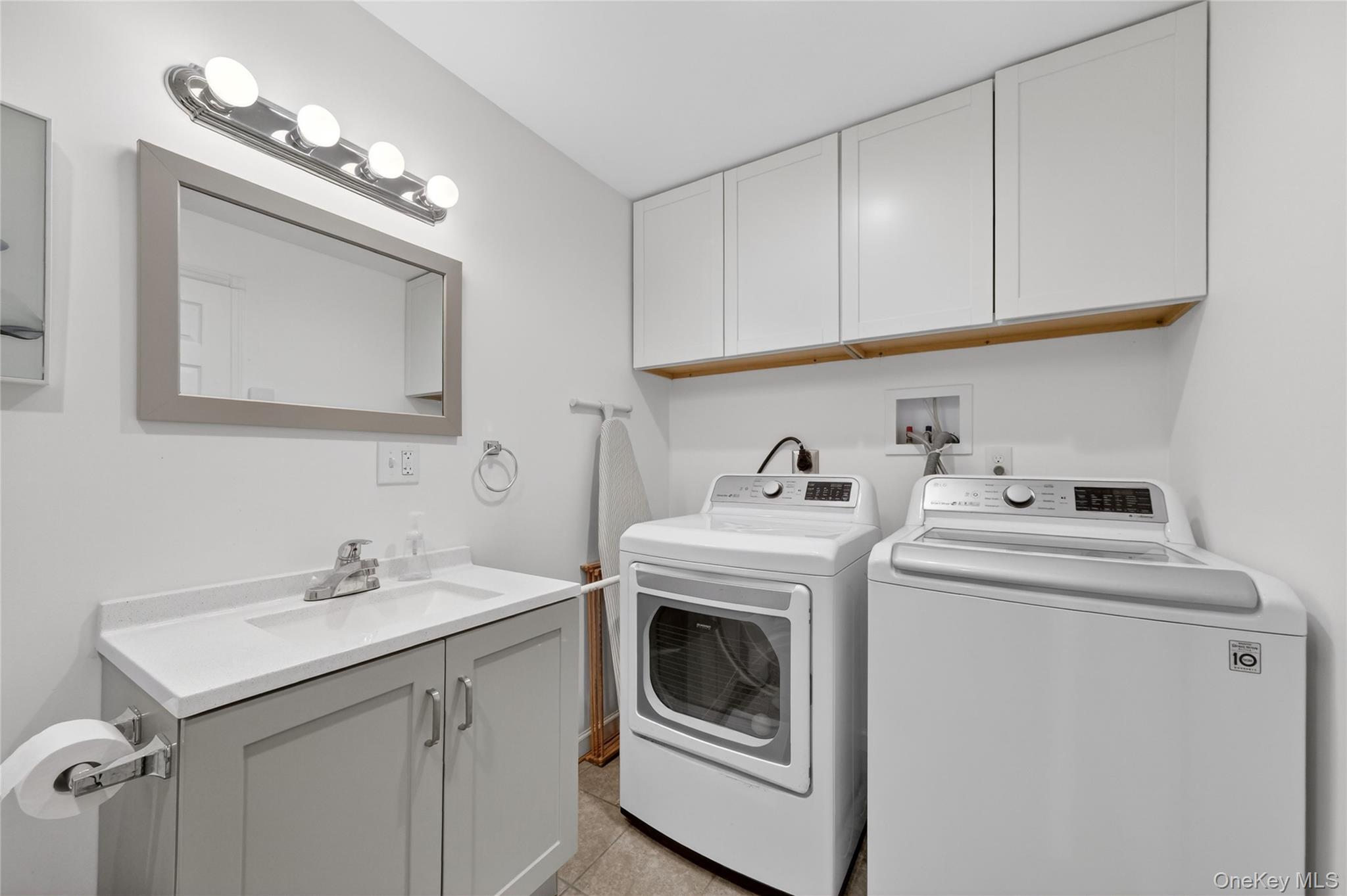 457 Forest Road Wallkill, NY 12589 - Photo 19 of 44 a utility room with sink dryer and washer