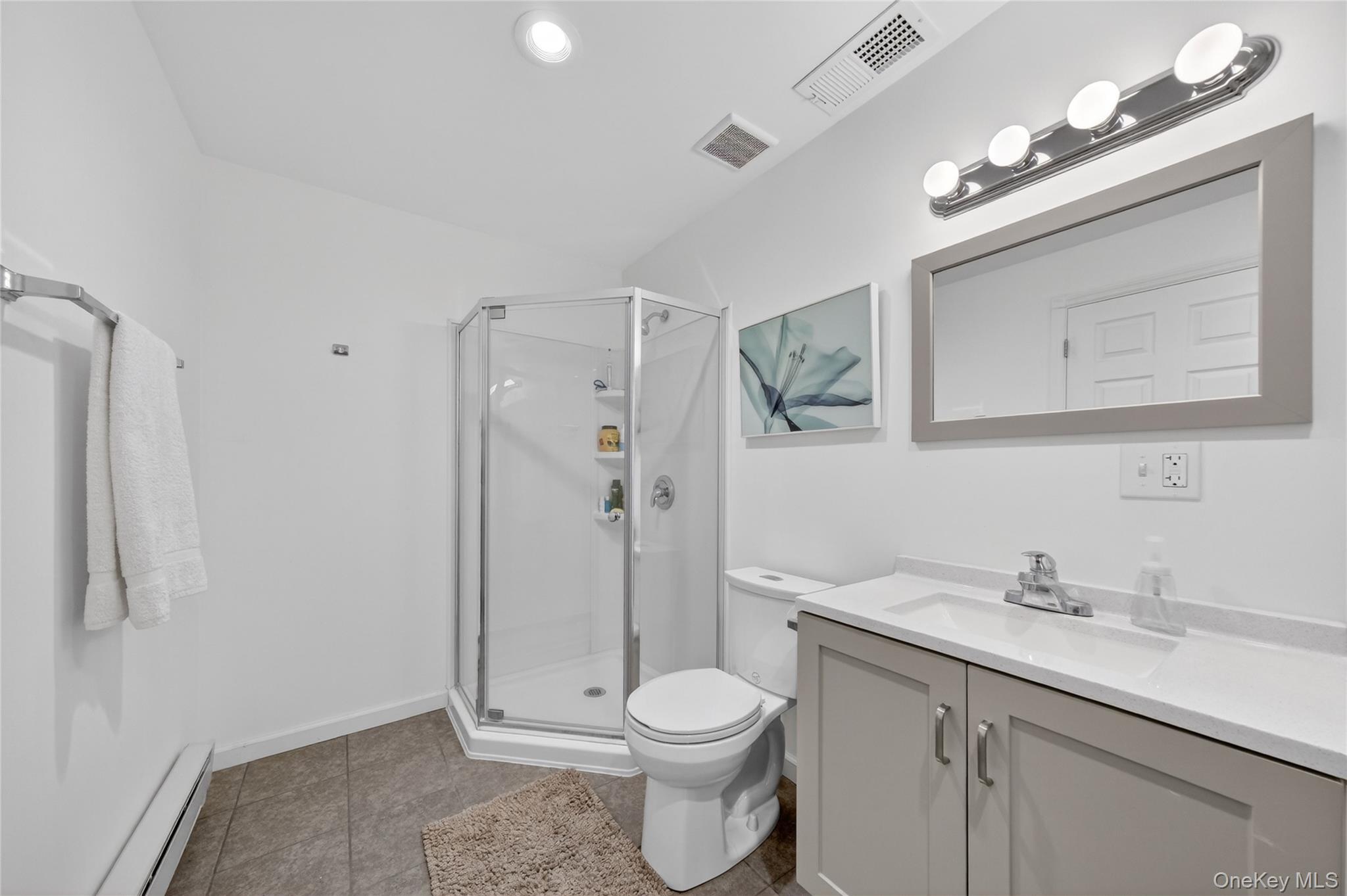 457 Forest Road Wallkill, NY 12589 - Photo 20 of 44 a bathroom with a toilet sink vanity granite and shower