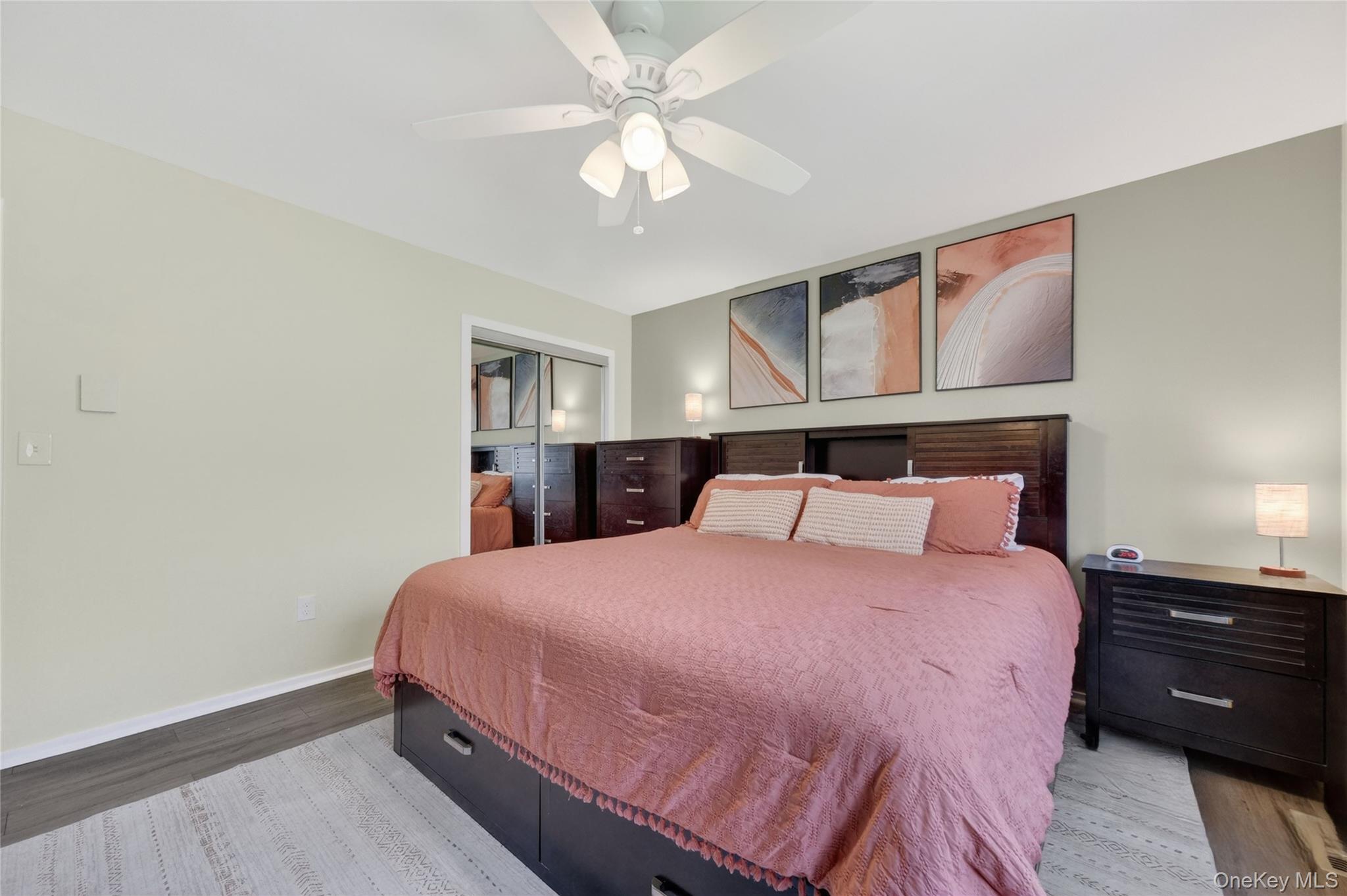 457 Forest Road Wallkill, NY 12589 - Photo 22 of 44 a bedroom with a bed and a chandelier