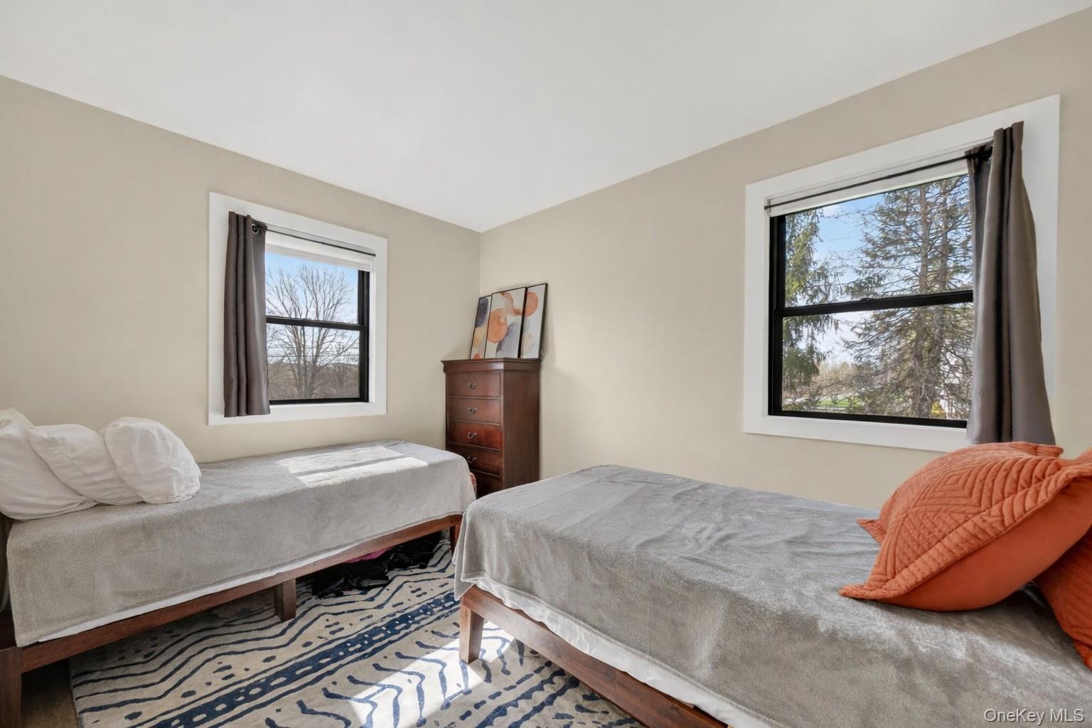 457 Forest Road Wallkill, NY 12589 - Photo 25 of 44 a bedroom with a bed and wooden floor