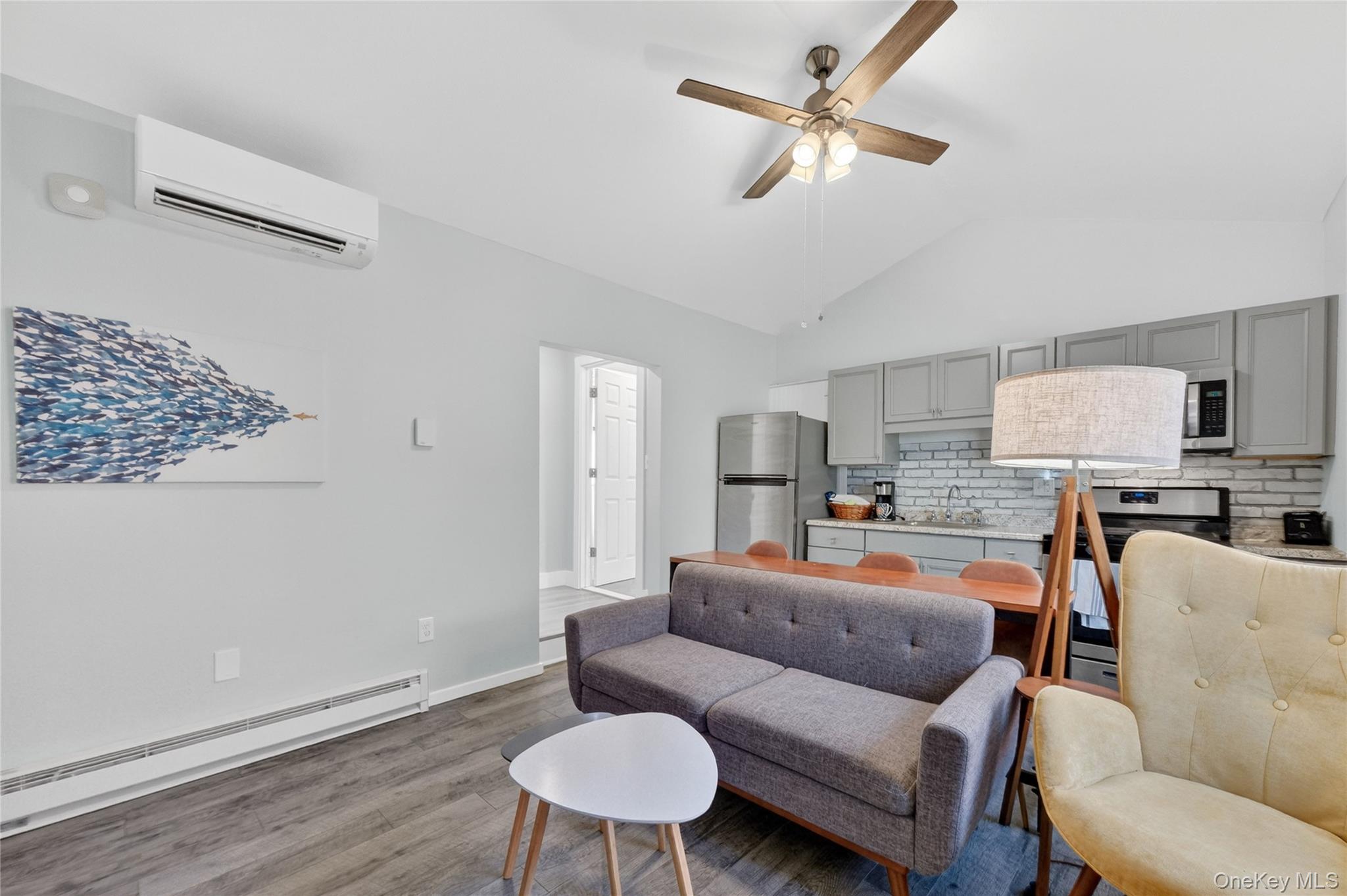 457 Forest Road Wallkill, NY 12589 - Photo 28 of 44 a living room with furniture a ceiling fan and a rug
