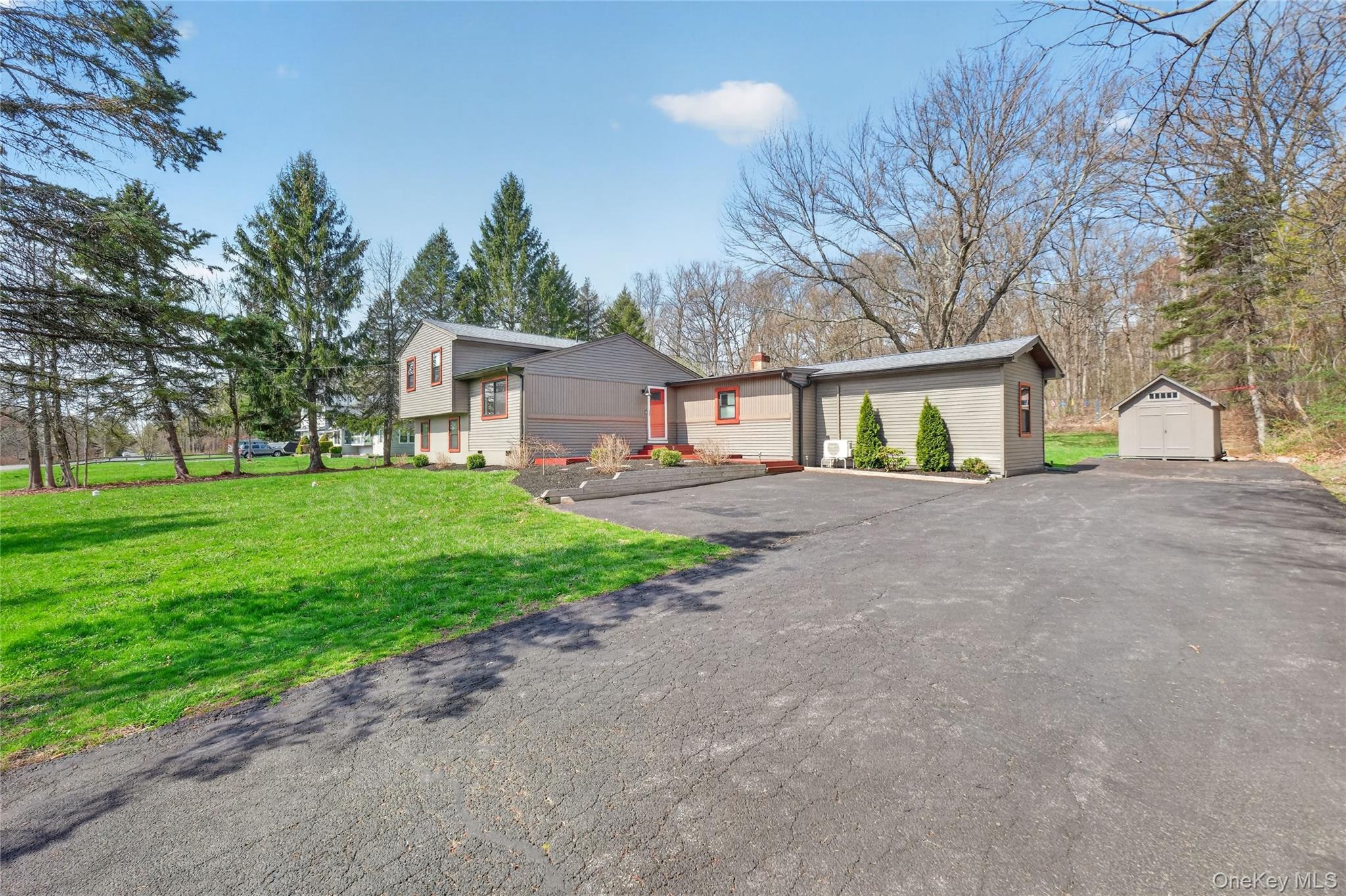 457 Forest Road Wallkill, NY 12589 - Photo 3 of 44 a front view of house with yard and green space