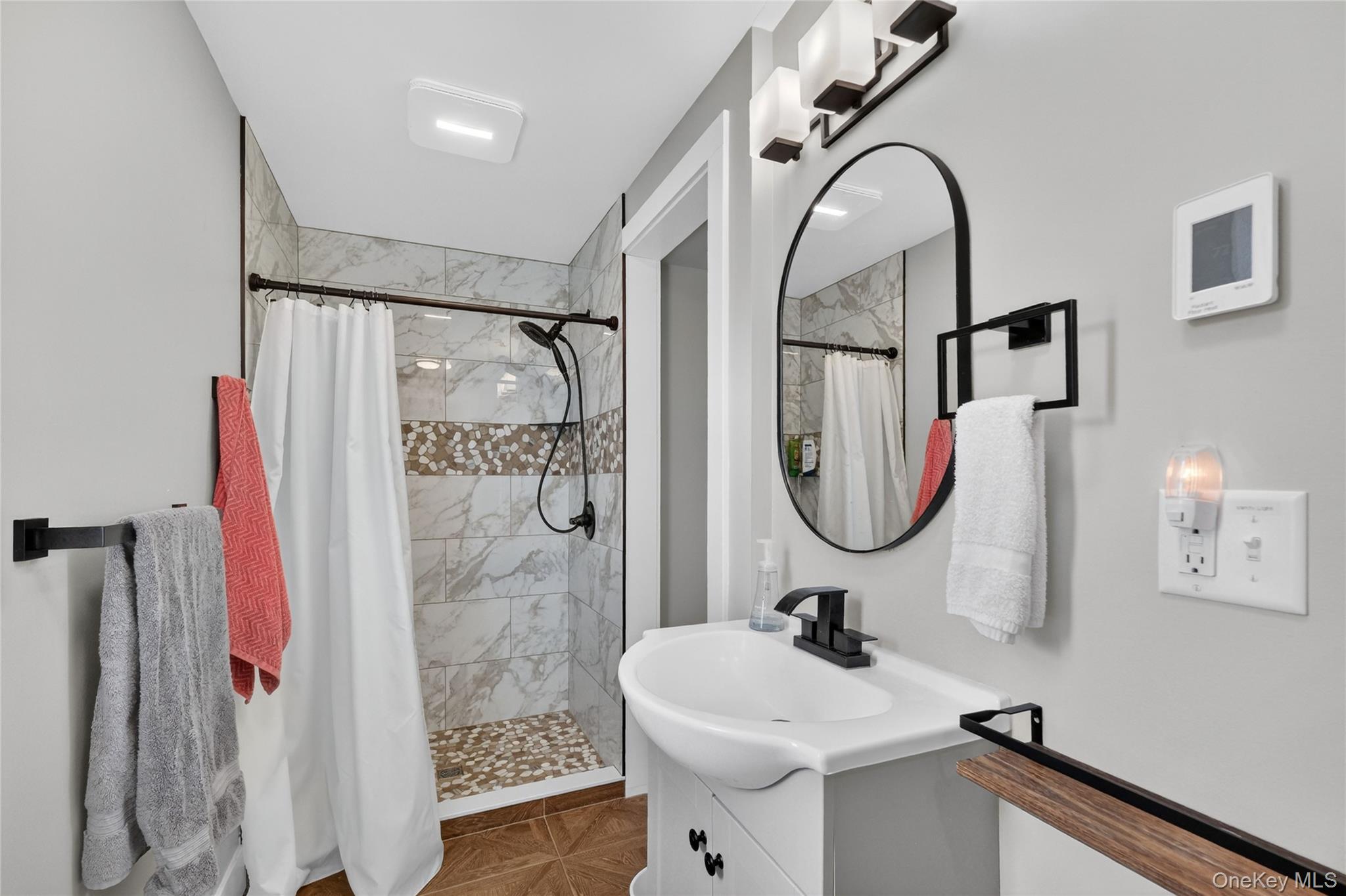 457 Forest Road Wallkill, NY 12589 - Photo 33 of 44 a bathroom with a sink a toilet and a mirror