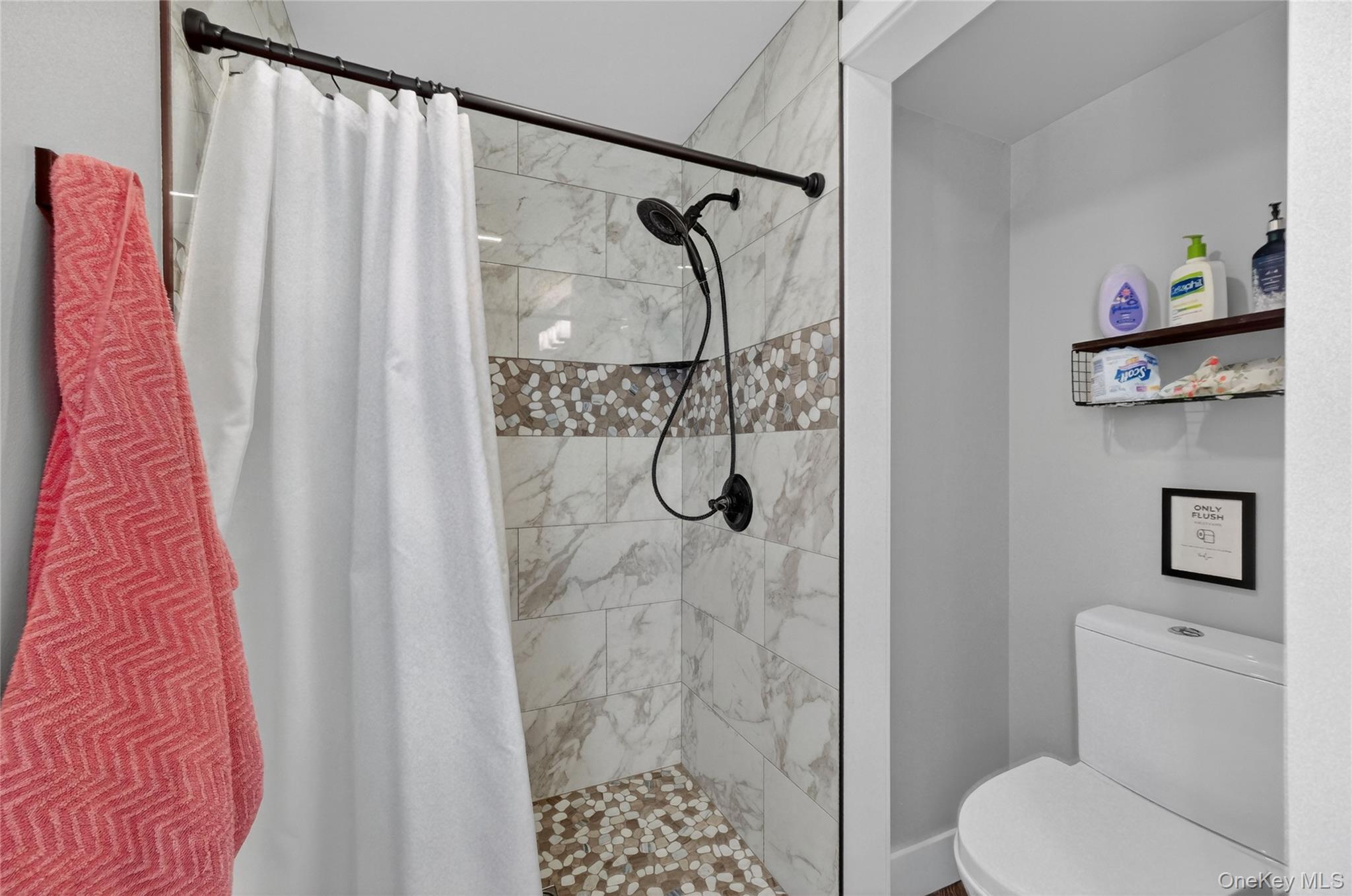 457 Forest Road Wallkill, NY 12589 - Photo 34 of 44 a bathroom with a shower toilet and sink