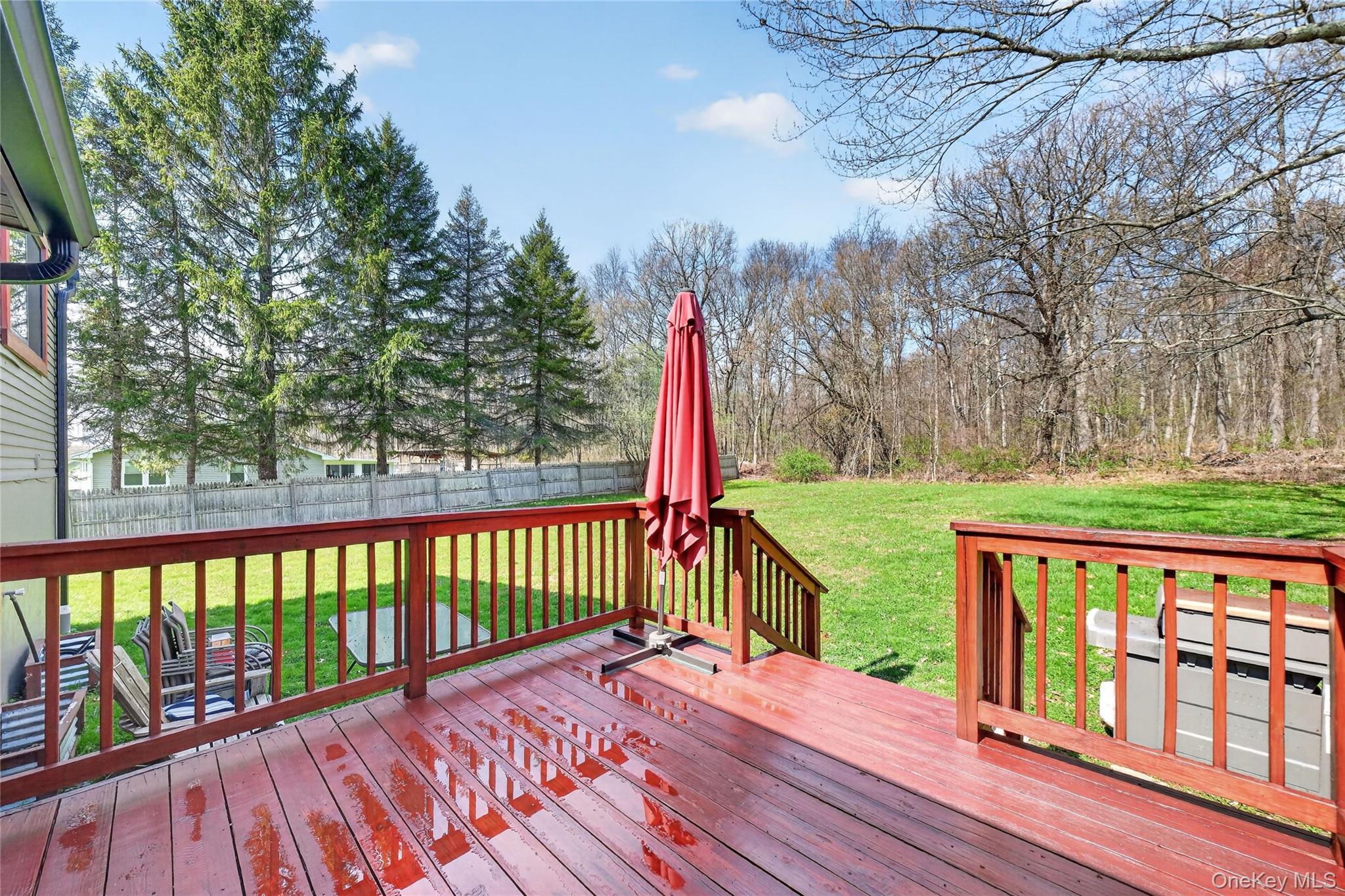 457 Forest Road Wallkill, NY 12589 - Photo 36 of 44 a view of a deck with a yard and wooden fence