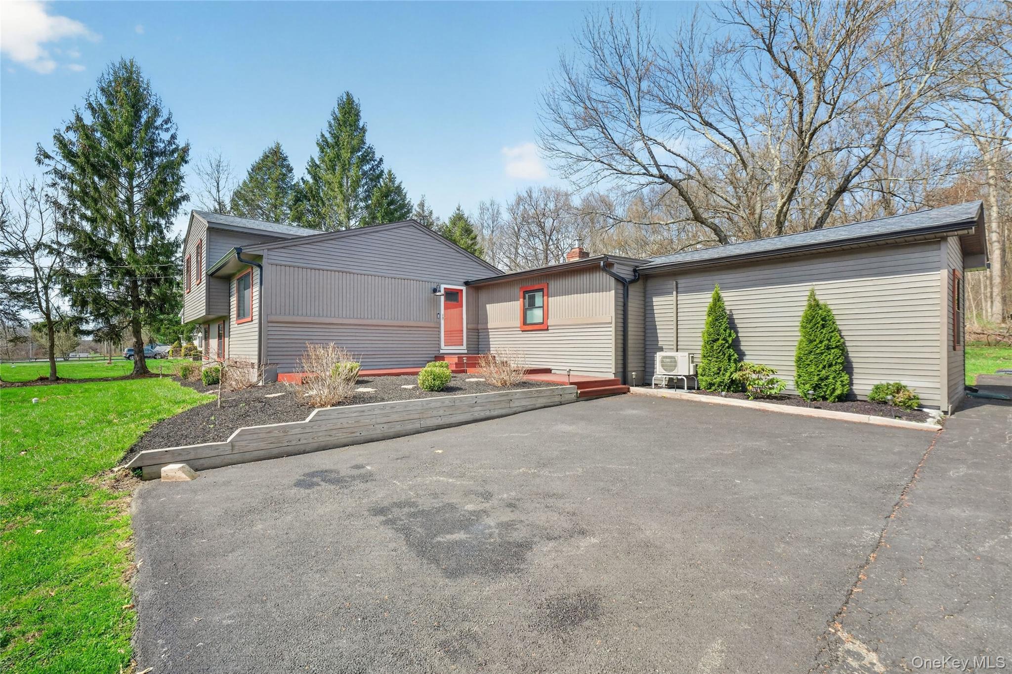 457 Forest Road Wallkill, NY 12589 - Photo 5 of 44 a view of a house with a yard and garage