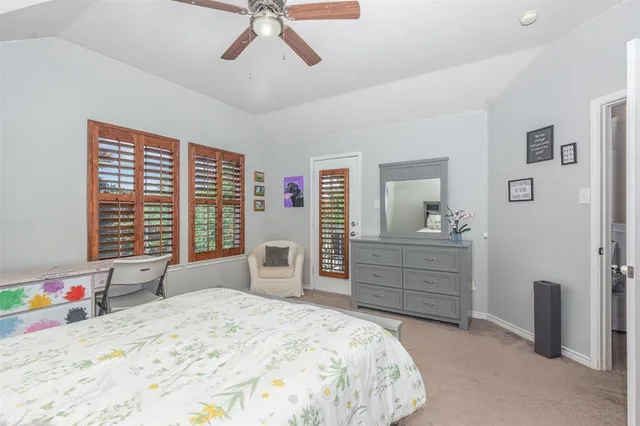 a bedroom with a bed dresser and a window