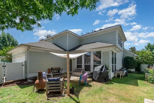a backyard of a house with seating space