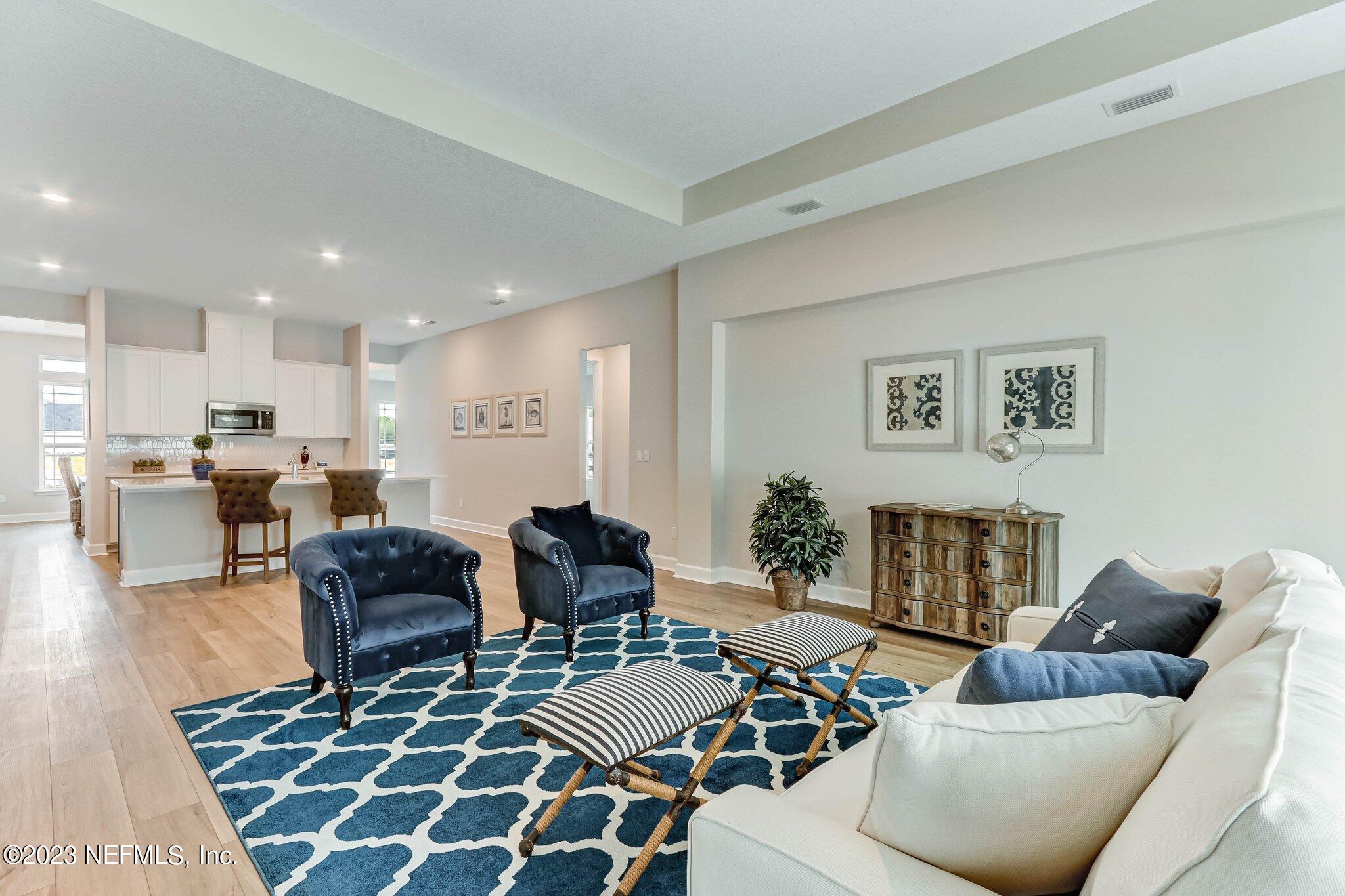 85156 Sandy Ridge Loop, Unit 18 Yulee, FL 32097 - Photo 15 of 25 a living room with furniture and a table