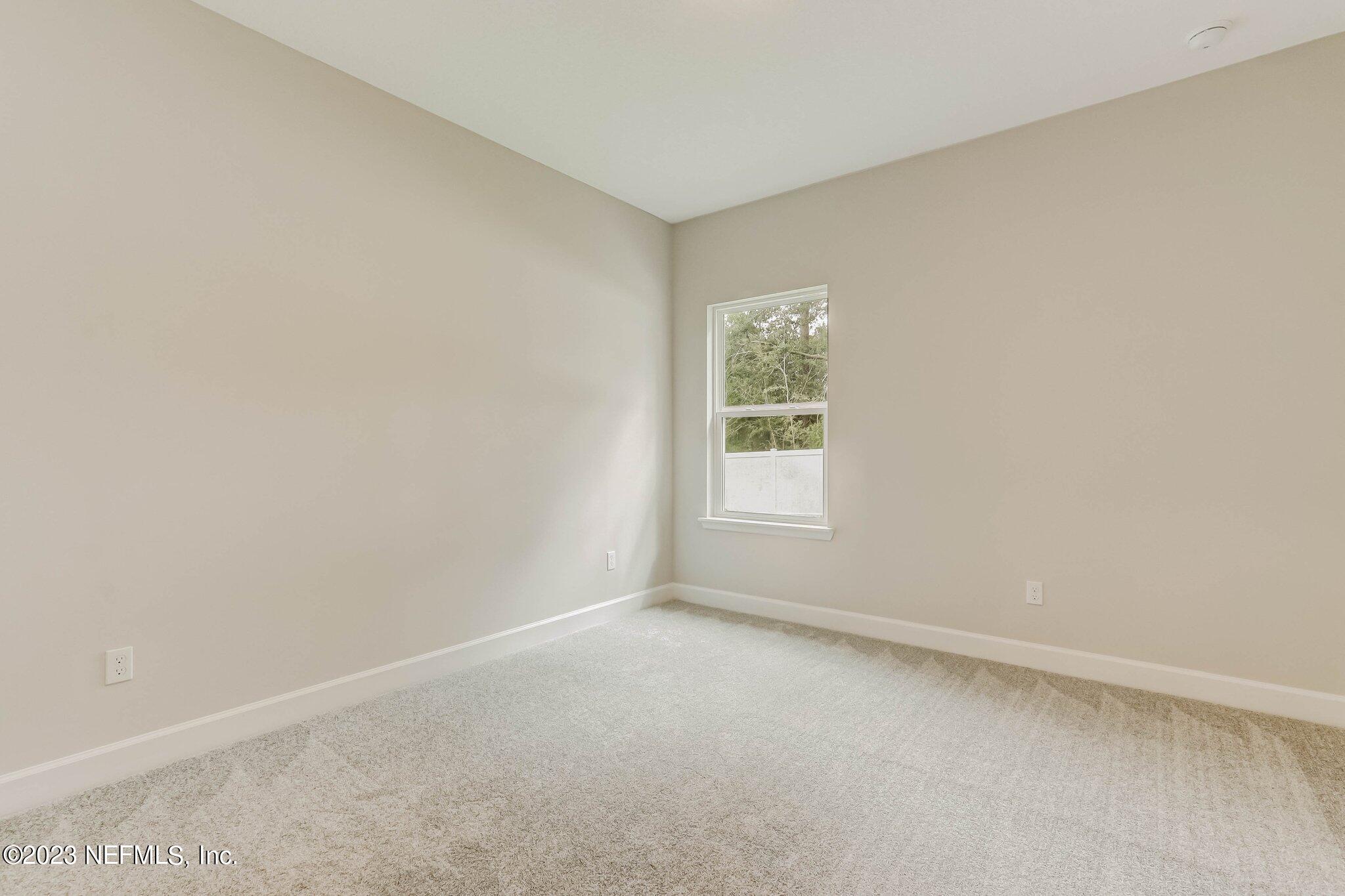 85156 Sandy Ridge Loop, Unit 18 Yulee, FL 32097 - Photo 20 of 25 an empty room with a window