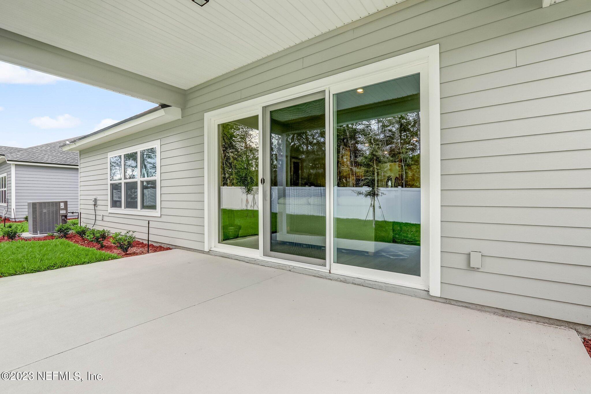 85156 Sandy Ridge Loop, Unit 18 Yulee, FL 32097 - Photo 24 of 25 a view of a house with a backyard