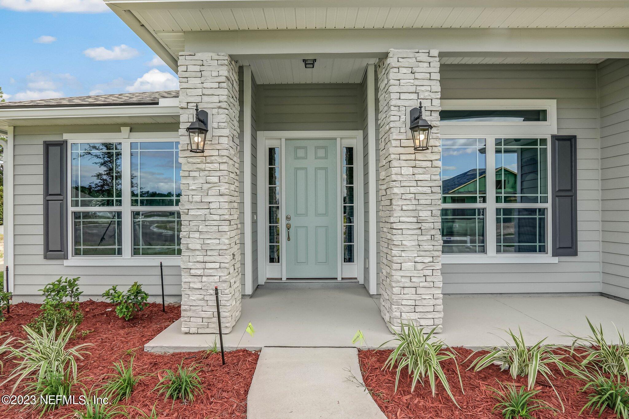 85156 Sandy Ridge Loop, Unit 18 Yulee, FL 32097 - Photo 4 of 25 a front view of a house