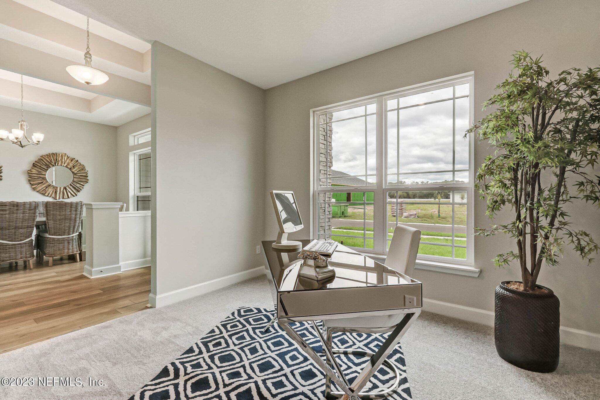 85156 Sandy Ridge Loop, Unit 18 Yulee, FL 32097 - Photo 7 of 25 a living room with furniture and a window