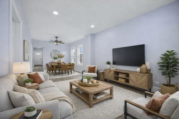 a living room with furniture and a flat screen tv