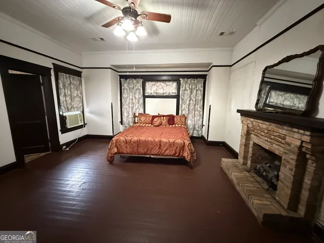 a bed room with furniture and a fireplace