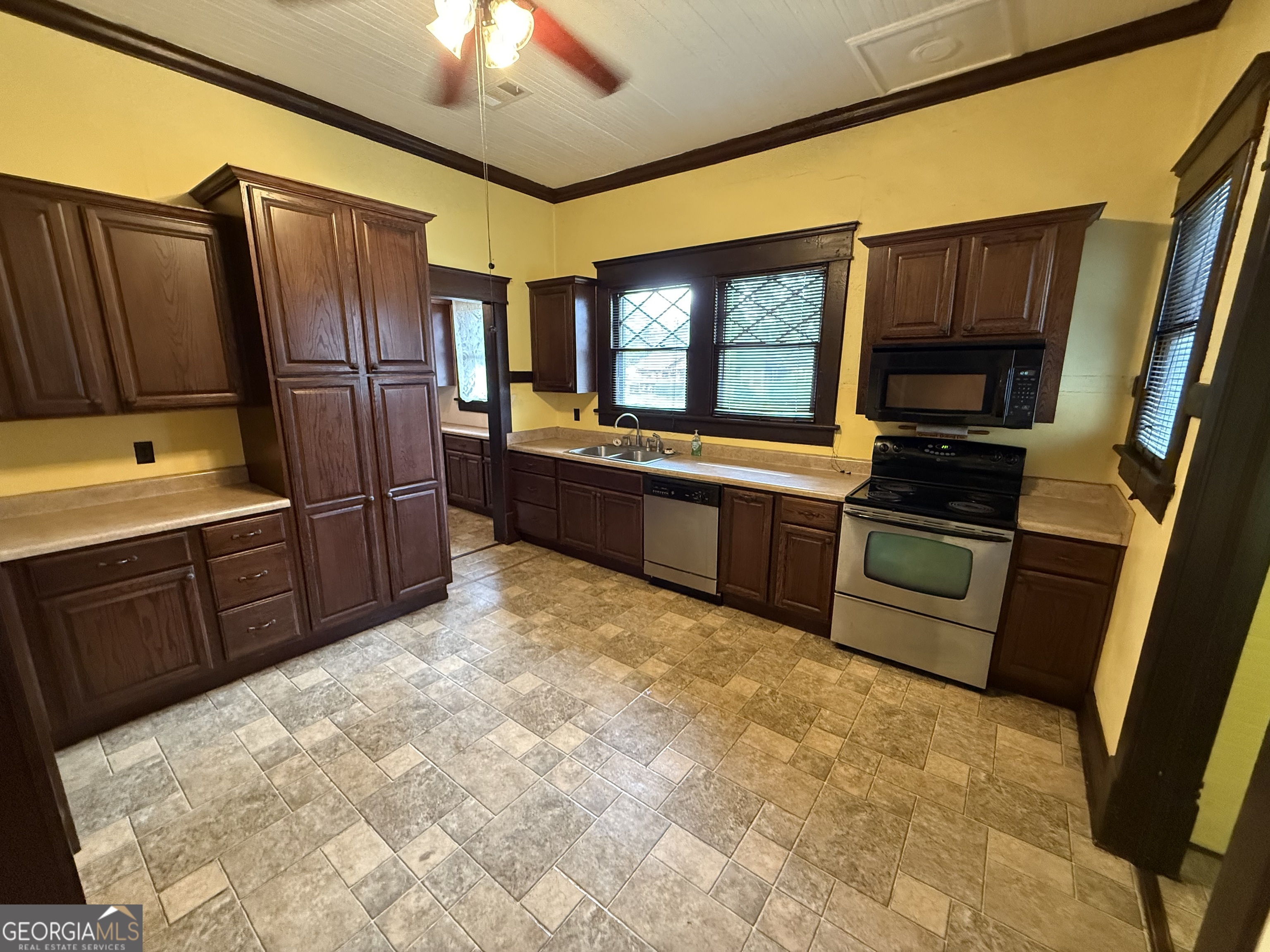 55 Hatcher Street Kite, GA 31049 - Photo 14 of 32 a kitchen with stainless steel appliances granite countertop a refrigerator and a stove top oven