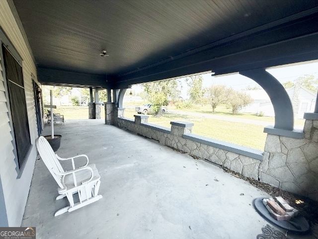 55 Hatcher Street Kite, GA 31049 - Photo 18 of 32 a view of an empty room with a floor to ceiling window