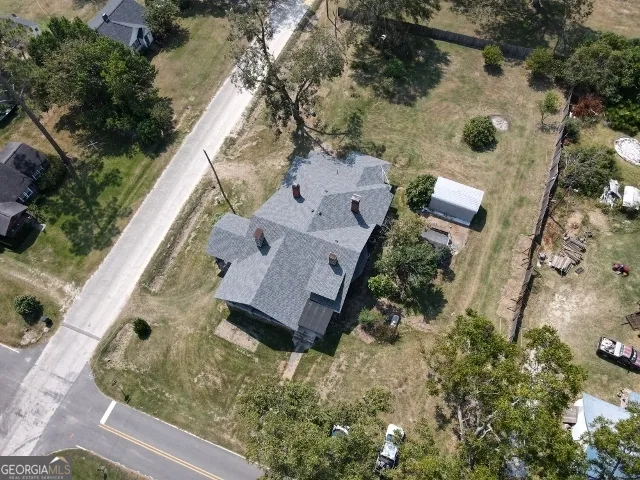 an aerial view of house with yard