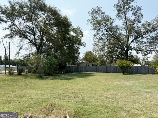 55 Hatcher Street Kite, GA 31049 - Photo 21 of 32 a view of a swimming pool with lawn chairs and trees