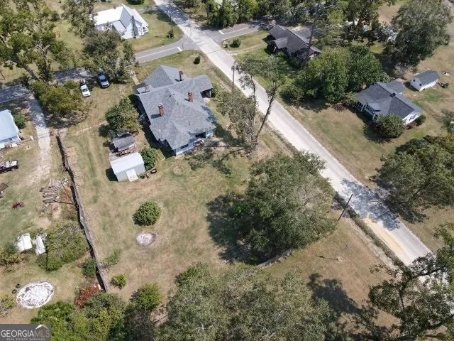 an aerial view of residential houses with outdoor space