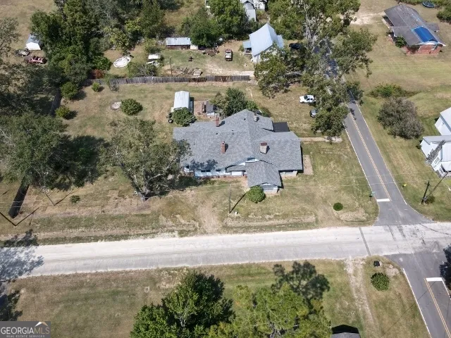 an aerial view of residential houses with outdoor space