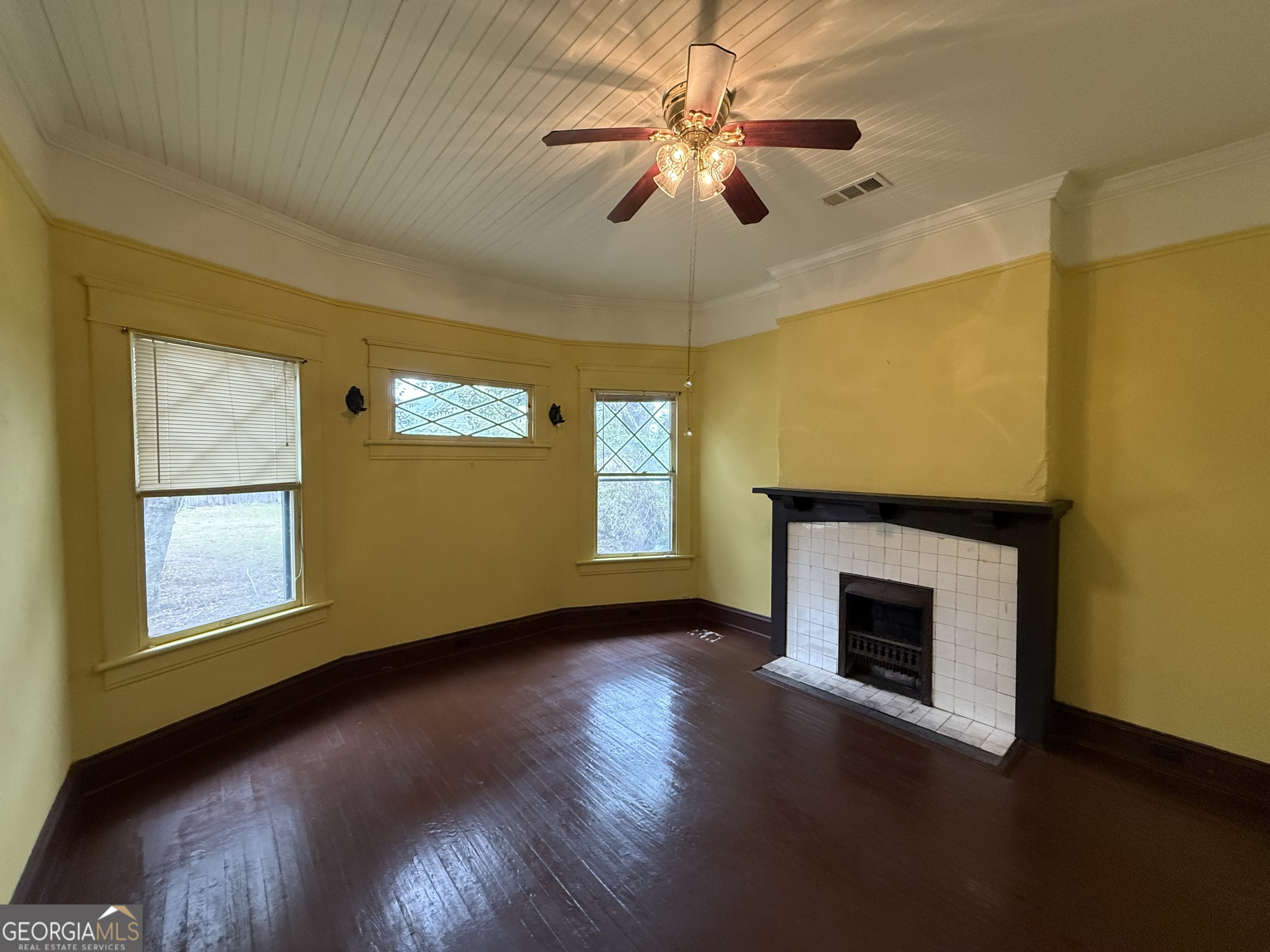 55 Hatcher Street Kite, GA 31049 - Photo 9 of 32 a view of an empty room with a fireplace and a window