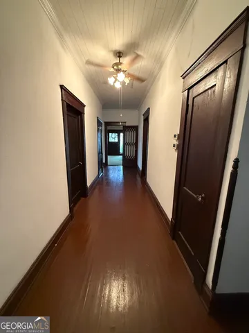 a view of a hallway with windows