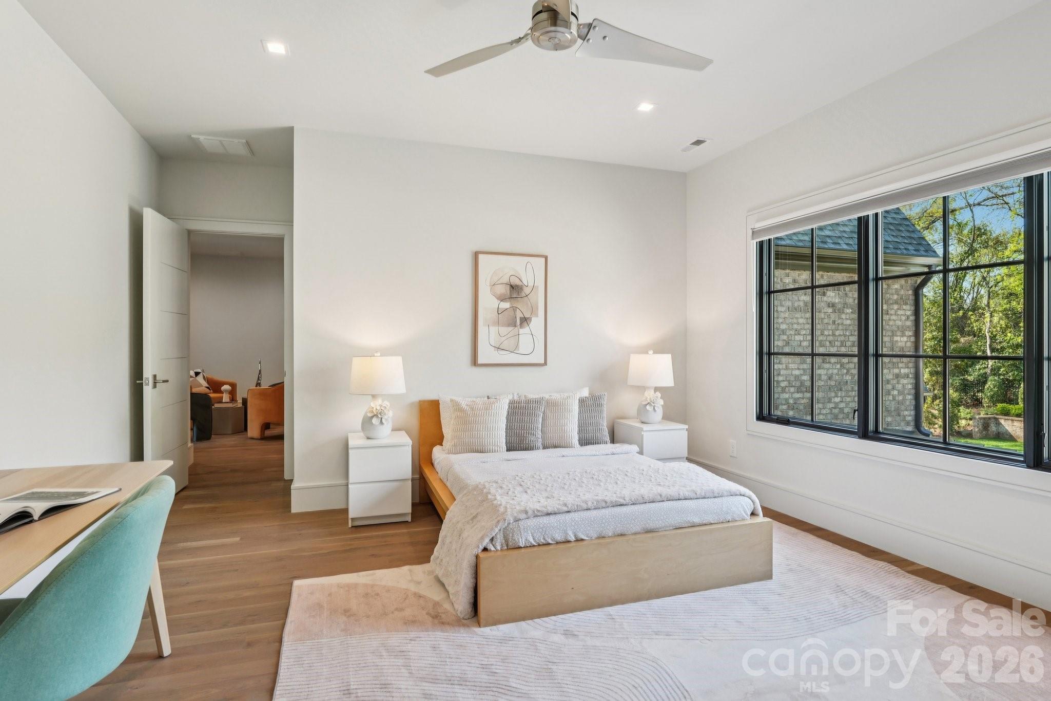 2103 Cortelyou Road Charlotte, NC 28211 - Photo 30 of 45 a spacious bedroom with a large bed and a large window