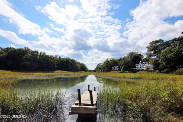 a view of a lake with a yard