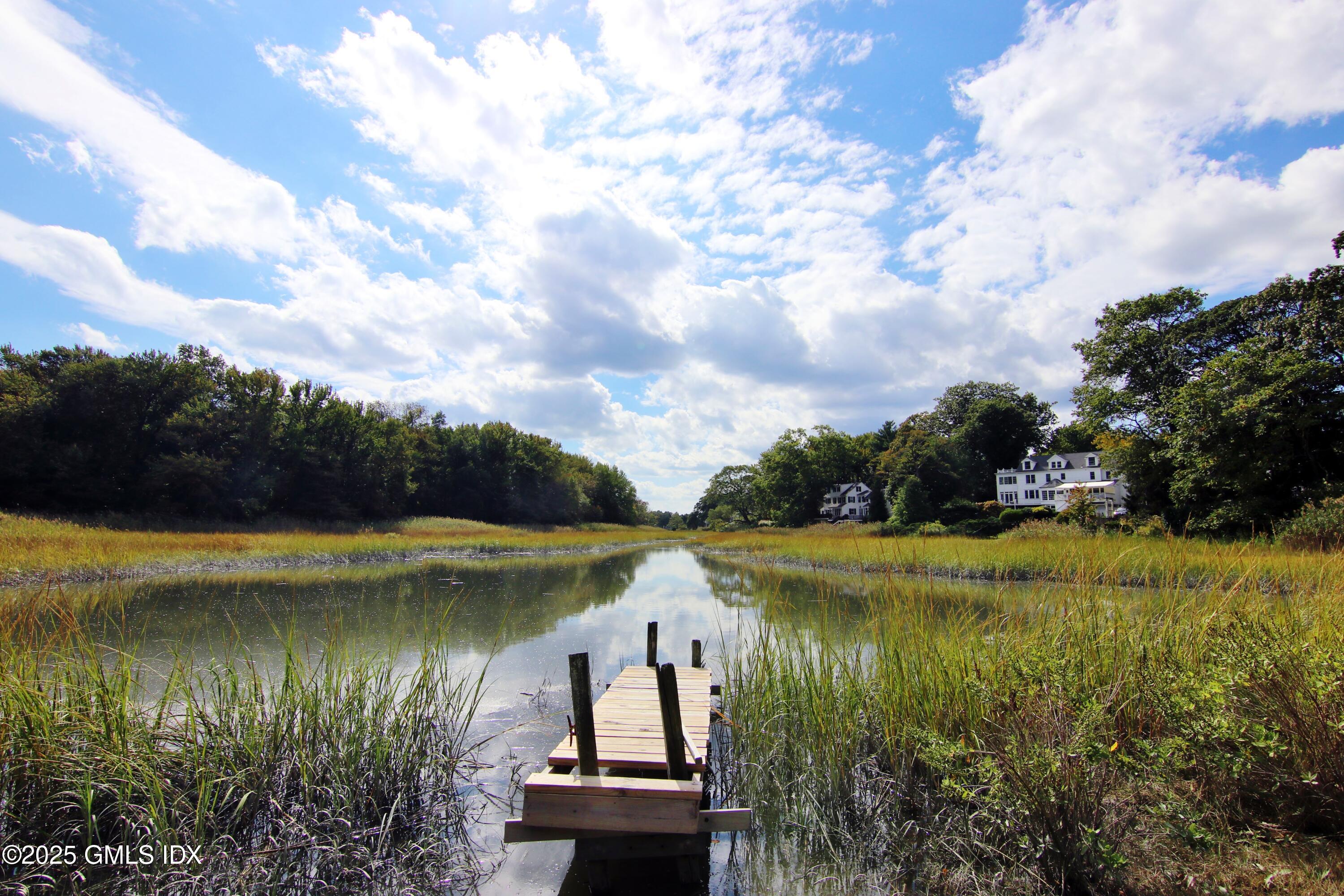 420 Davis Avenue Greenwich, CT 06830 - Photo 1 of 35 a view of a lake with a yard