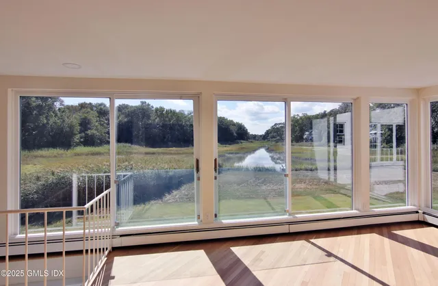 a view of a room with a large window