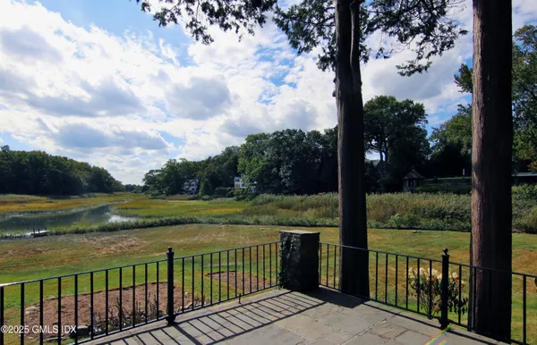 a view of a lake with houses in the back