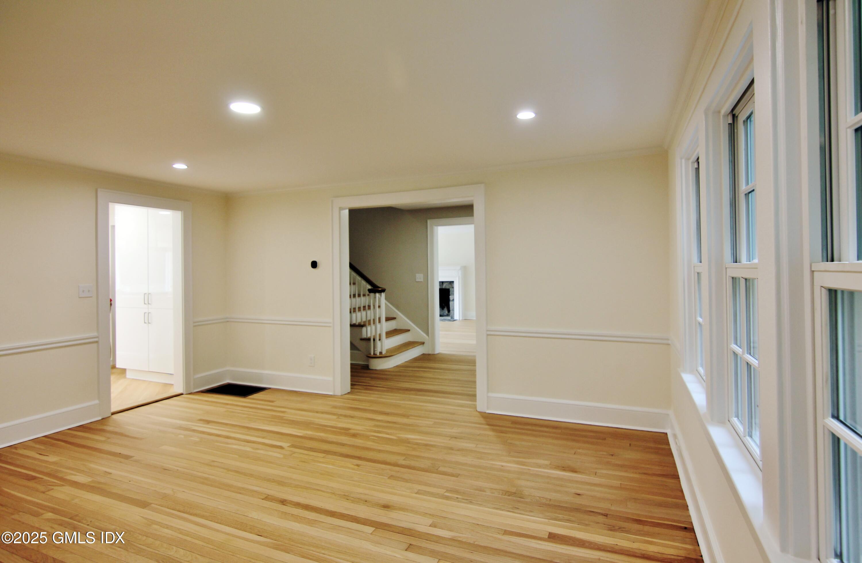 420 Davis Avenue Greenwich, CT 06830 - Photo 5 of 35 a view of a livingroom with wooden floor and white doors