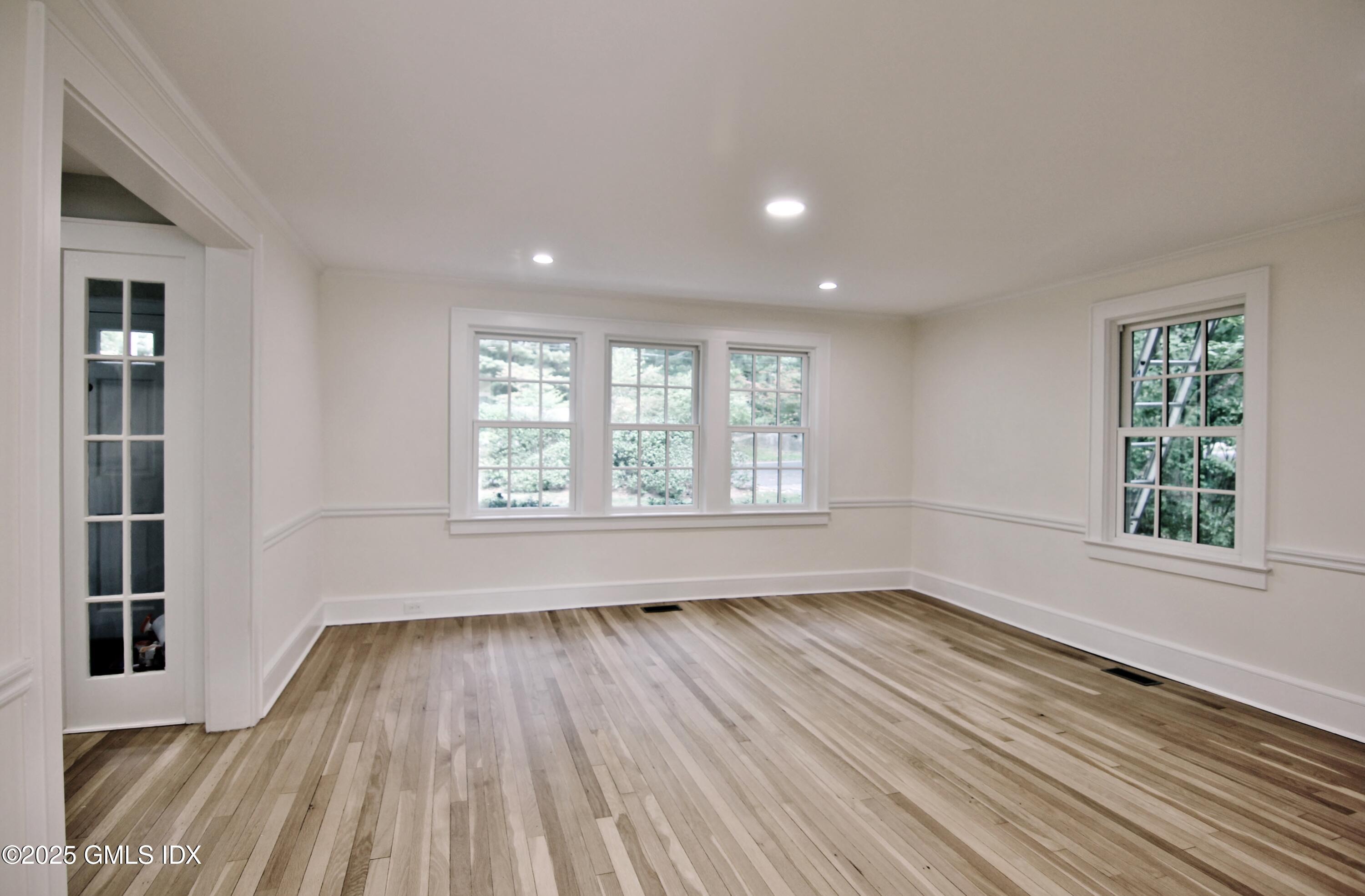 420 Davis Avenue Greenwich, CT 06830 - Photo 6 of 35 wooden floor in an empty room with a window