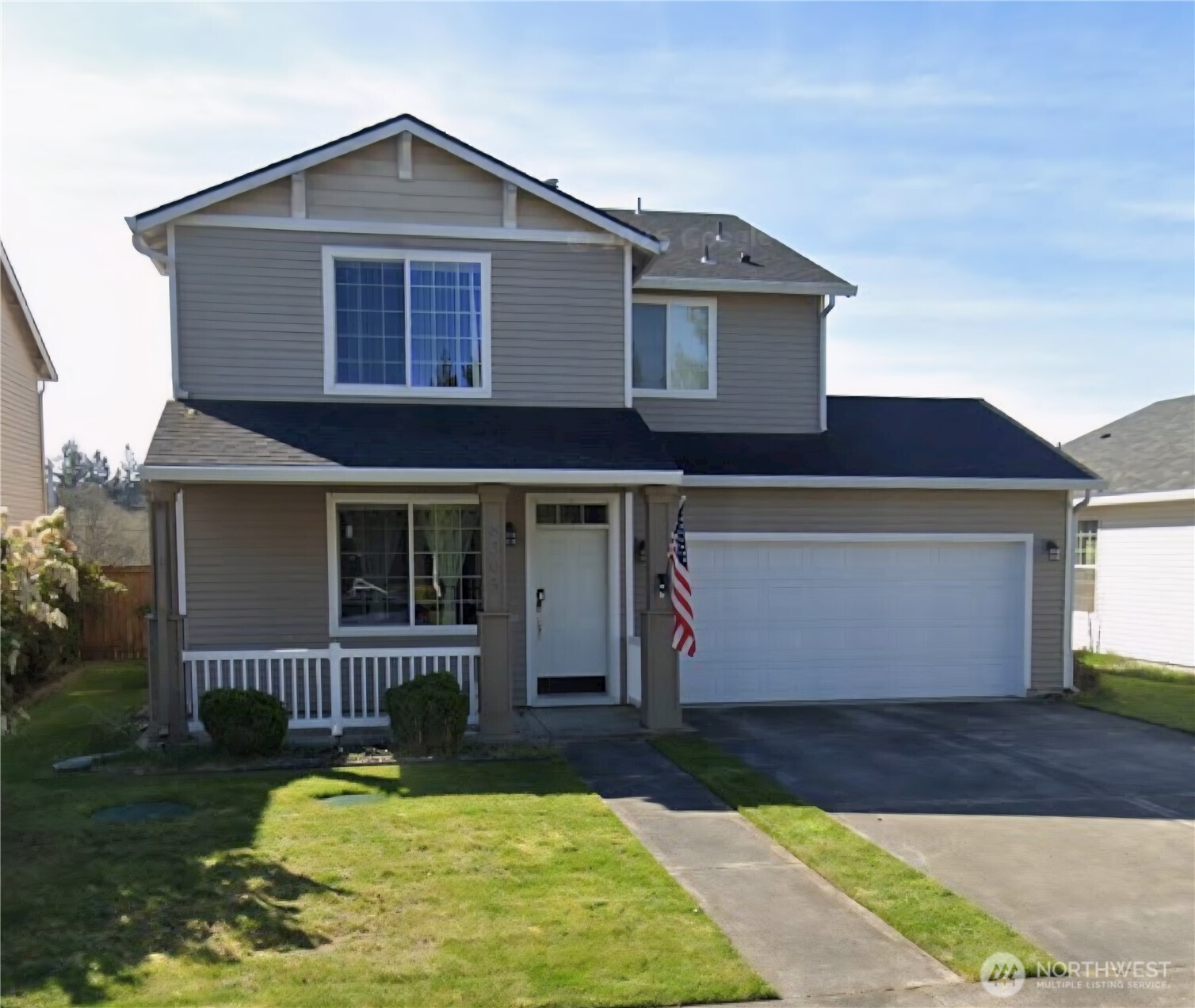 8305 Sweetbrier Loop Southeast Olympia, WA 98513 - Photo 1 of 40 a front view of a house with yard and garage