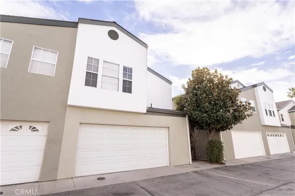 a front view of a house with a garage