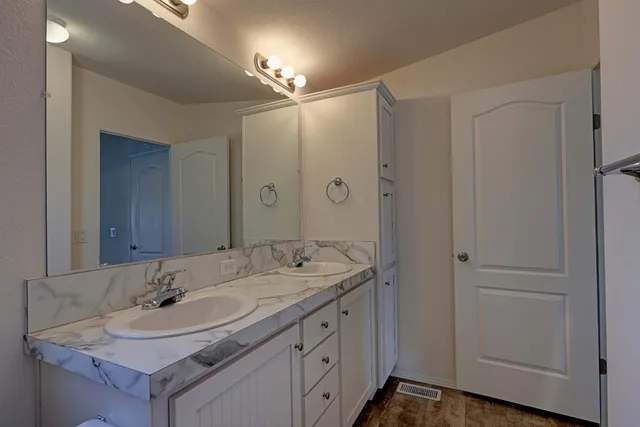 a bathroom with a sink and a mirror