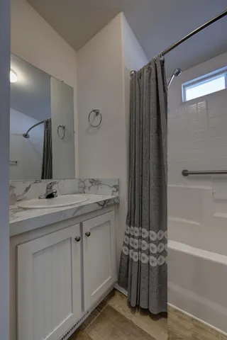 a bathroom with a double vanity sink and mirror