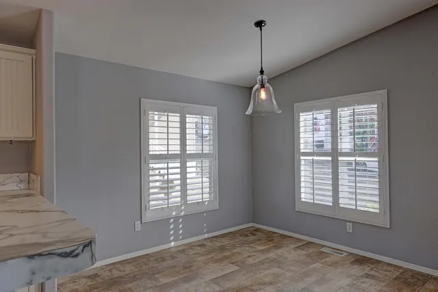 a view of an empty room with a window