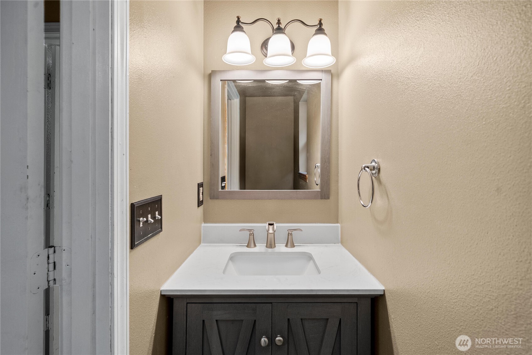 7923 Incline Court Southeast Olympia, WA 98513 - Photo 12 of 19 a bathroom with a sink vanity and a mirror