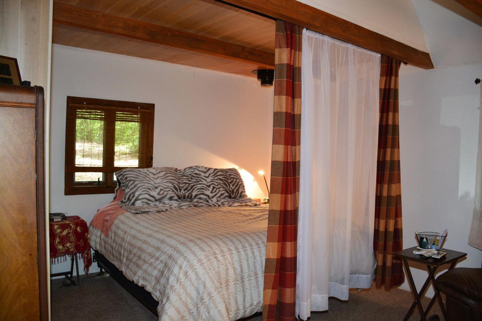 632 Faith Cove Road Sandy Level, VA 24161 - Photo 11 of 20 a bedroom with a bed and a window
