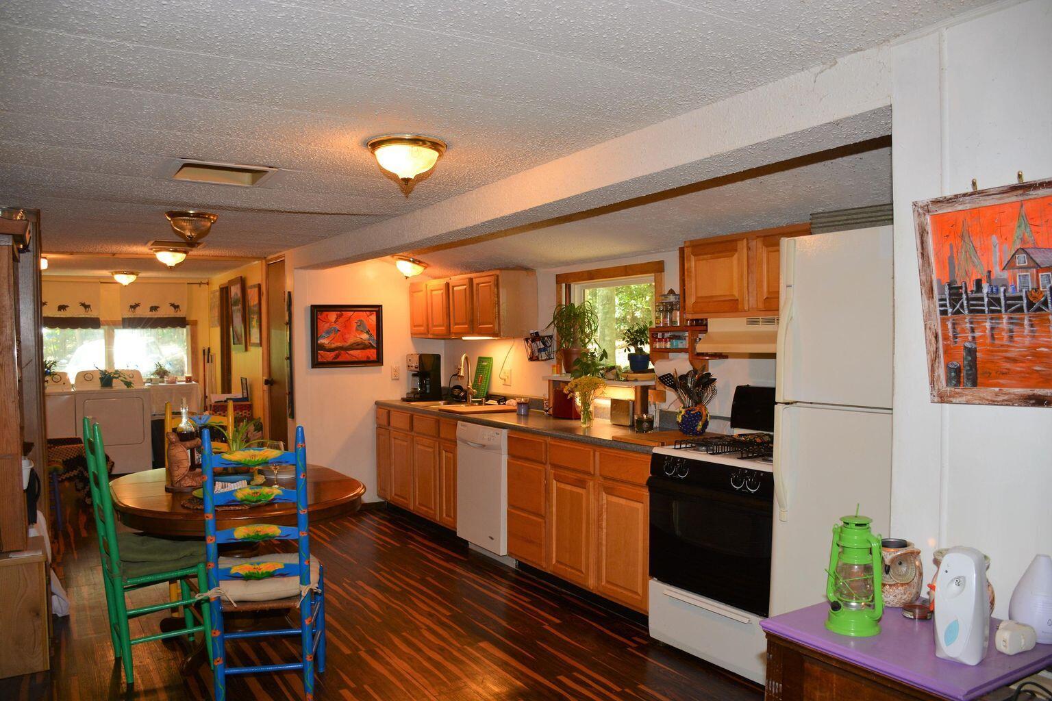 632 Faith Cove Road Sandy Level, VA 24161 - Photo 8 of 20 a kitchen that has a lot of cabinets a sink and appliances in it